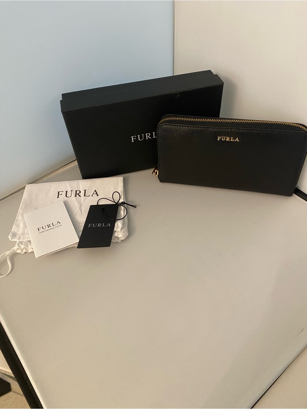 Furla Saffiano Black Leather Zip Around Wallet, red lining